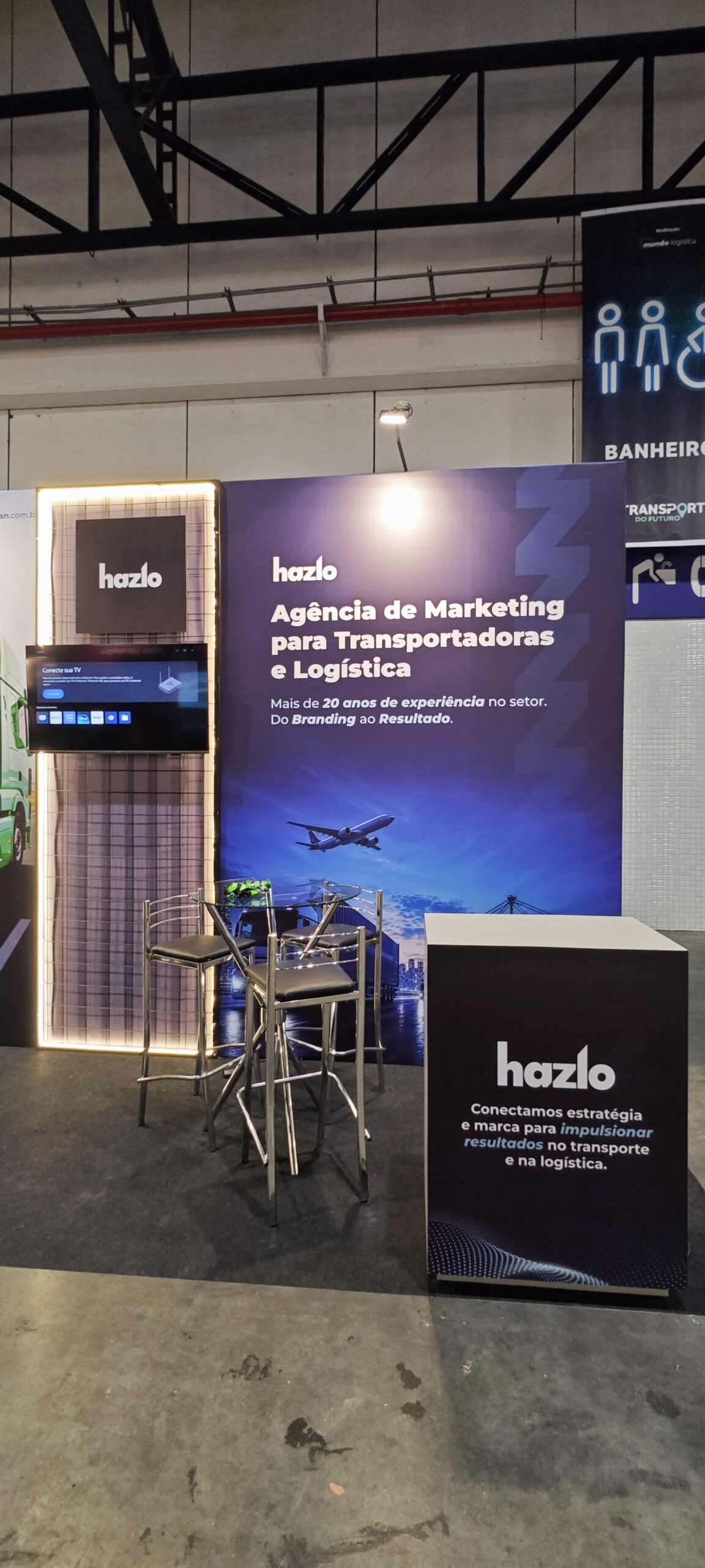 Estande da Hazlo na Transporte do Futuro 2026 com posicionamento de marketing para transportadoras e logística